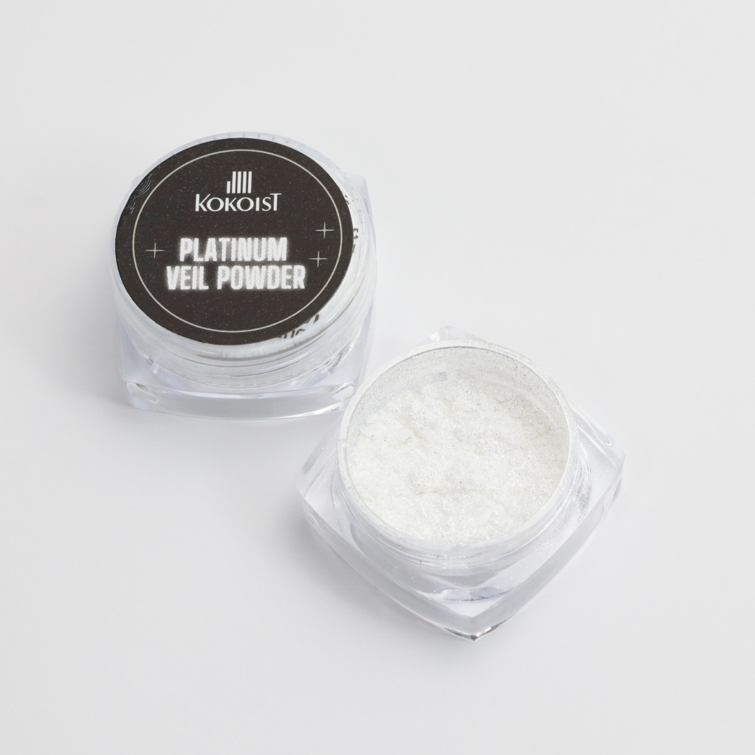 Kokoist Platinum Veil Powder in a clear container on a light gray background